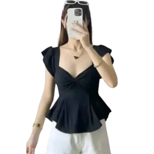 woman wearing black ruched peplum top with cap sleeves paired with white pants stylish korean fashion outfit